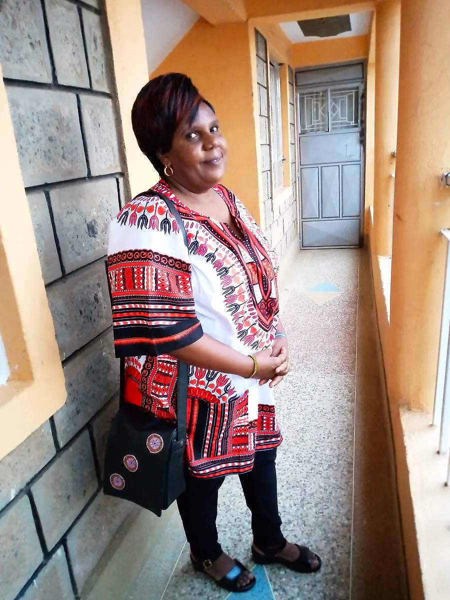 A woman wearing one of Mary’s fabric shoulder bags
