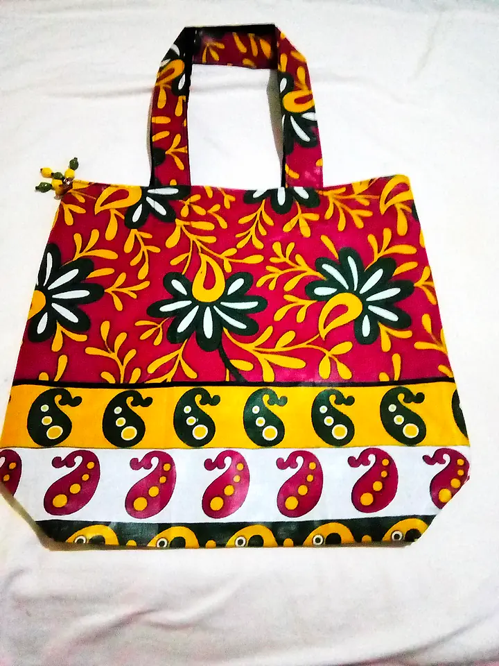 Shopping tote in a red and yellow paisley print