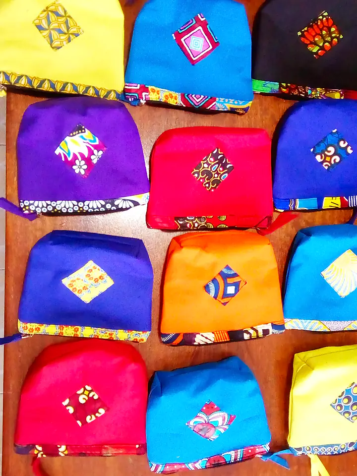 Zip pouches in bright solid colours with a diamond patch of African print