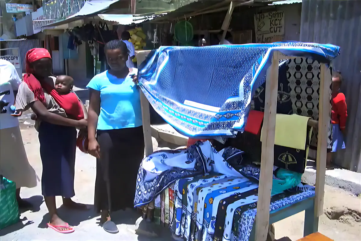 Kanga fabrics displayed at a market stall in Kenya